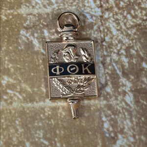 Phi Theta Kappa honor society gold pin
